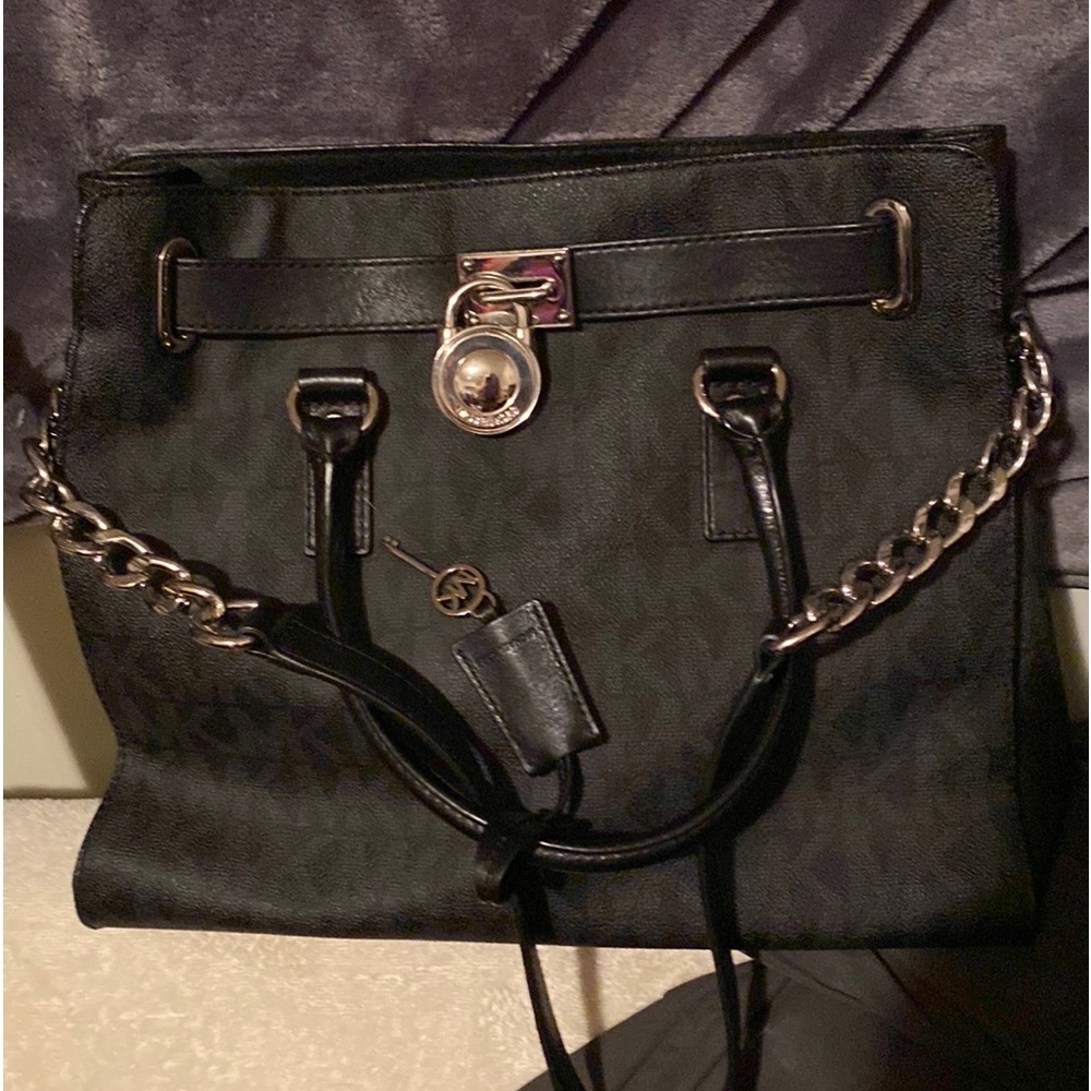 Michael Kors oversized, black with all silver hardware, handles and long strap